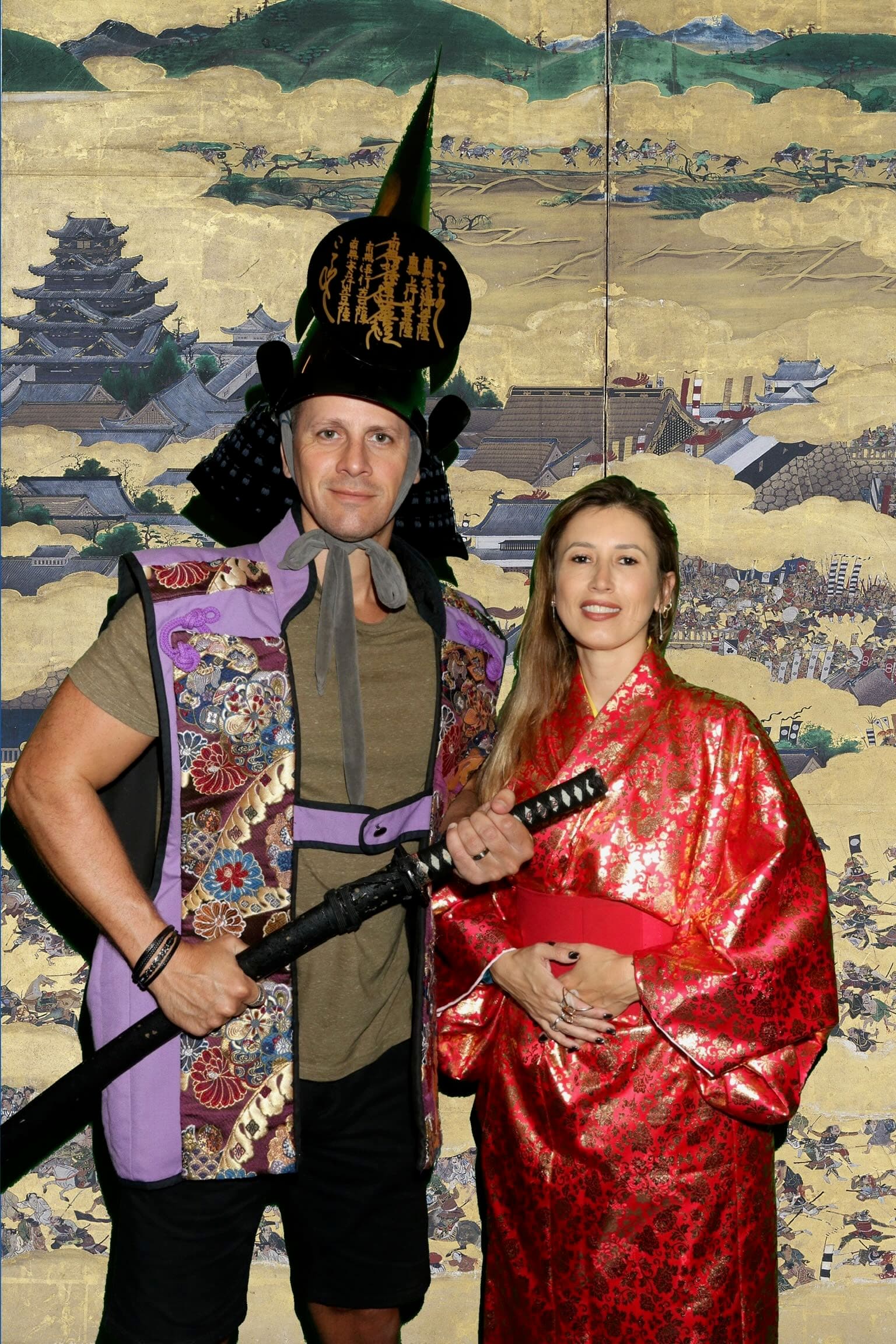 Wilson and Fatima in samurai costumes in front of Osaka Castle, Japan
