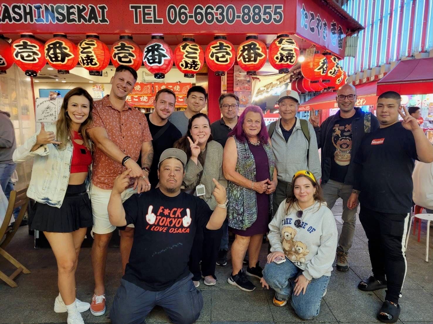 Group at izakaya restaurant small plates and sake, Osaka Japan
