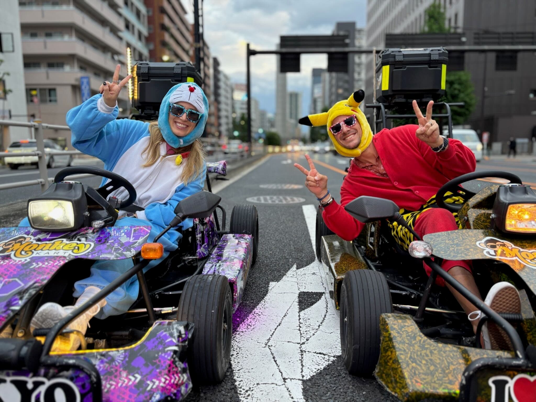 Go-kart rider in costume driving through Tokyo streets, Japan