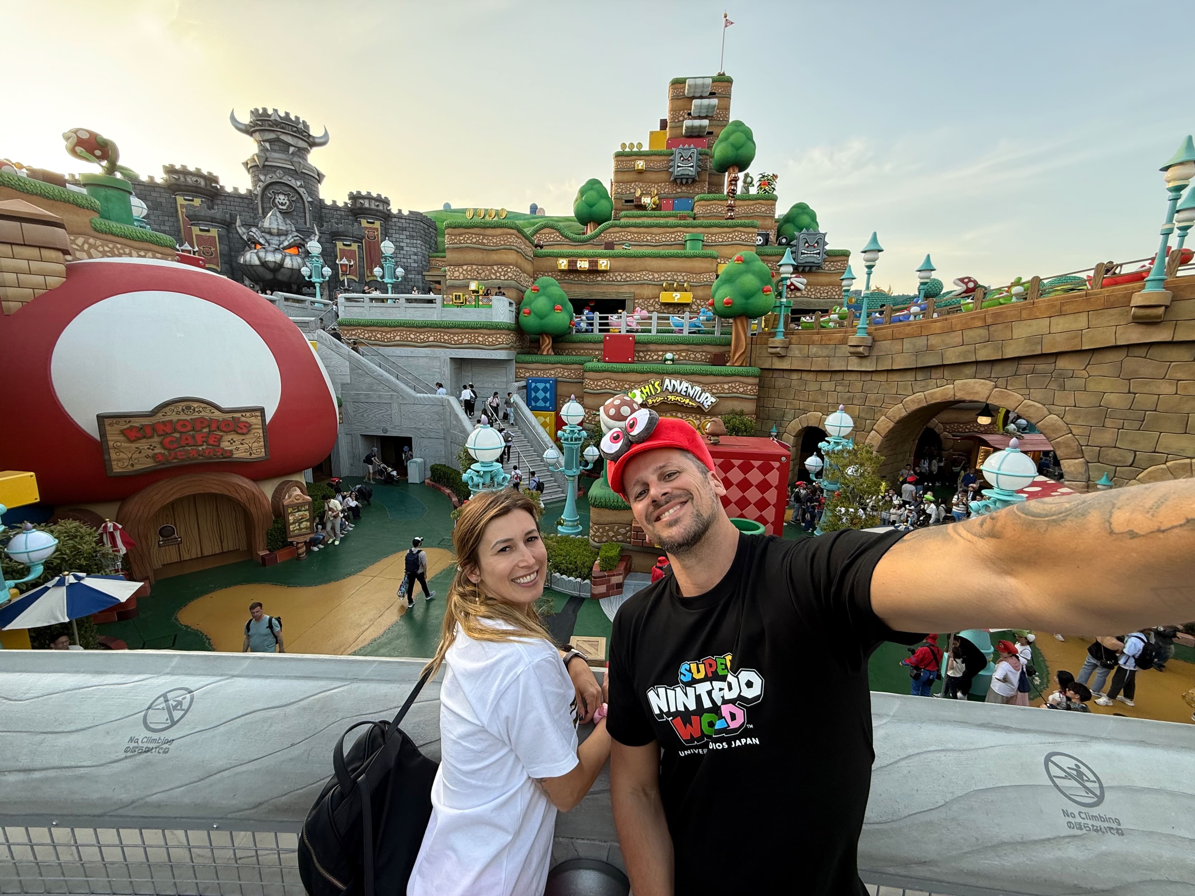 Super Nintendo World entrance with Bowser's Castle and colourful Mario-themed decorations at Universal Studios Japan