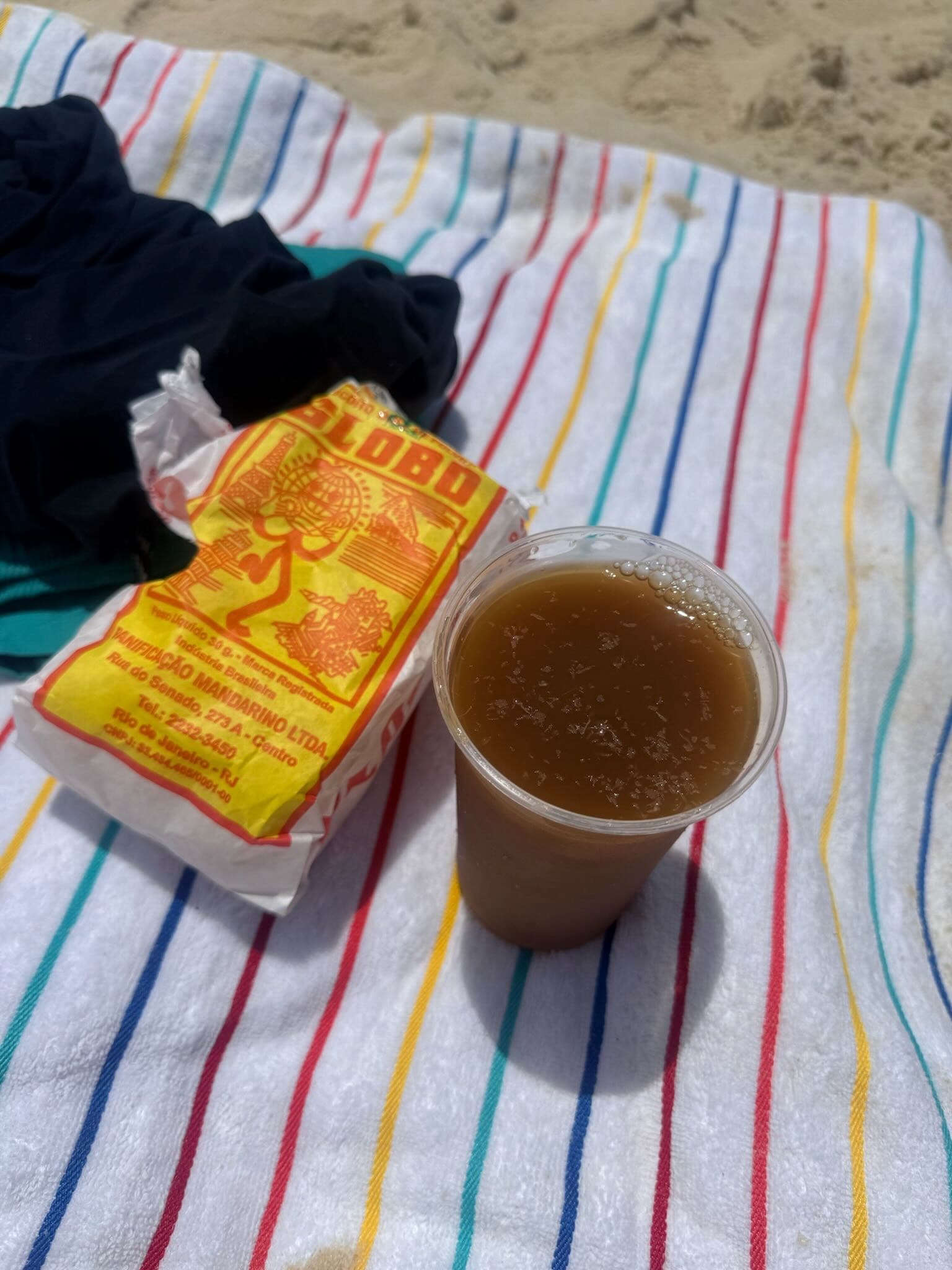 Mate tea and Biscoito Globo on a beach towel, Rio de Janeiro